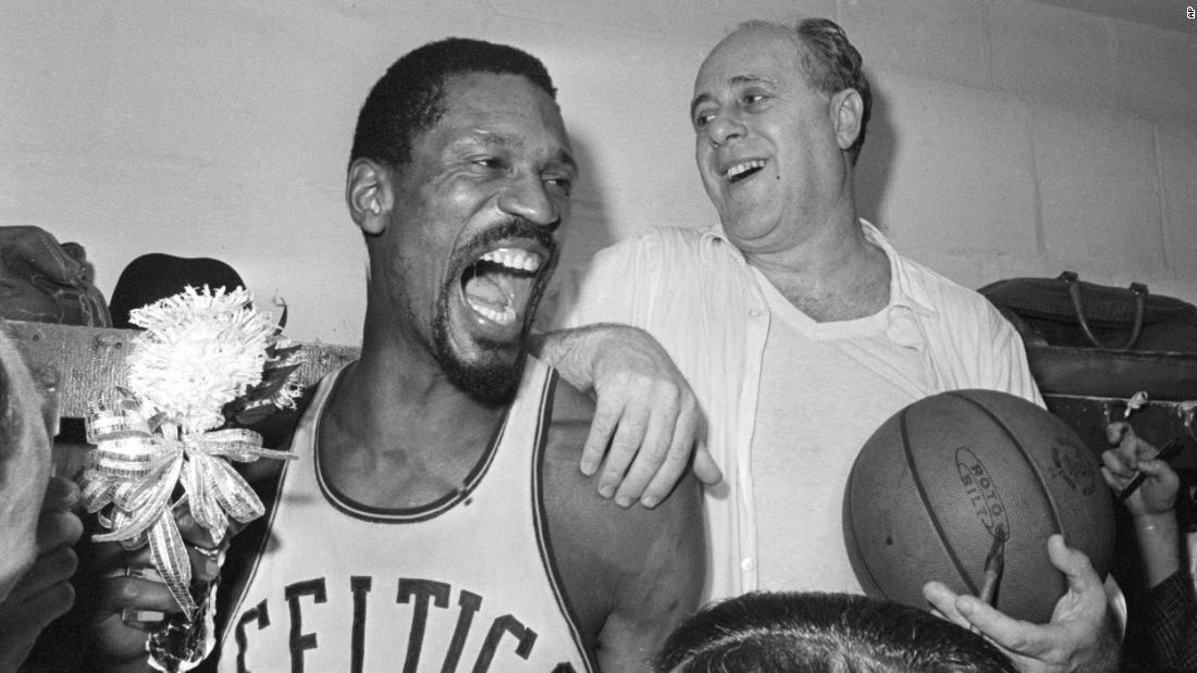 Russell celebrates with Auerbach in the locker room after defeating Los Angeles to win the 1966 NBA title. It was the team&#39;s eighth consecutive championship and Russell&#39;s ninth overall. He would go on to win two more in 1968 and 1969.