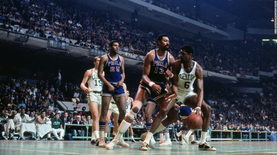 Russell, right, posts up against Philadelphia center Wilt Chamberlain during a game in Boston in 1968.&lt;br /&gt;