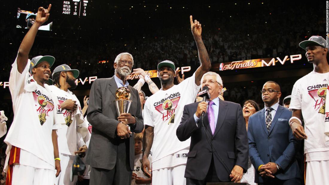 Russell looks on as then-NBA Commissioner David Stern presents Miami forward LeBron James with the Bill Russell NBA Finals Most Valuable Player Award in June 2012. In 2009, the NBA renamed the Finals MVP Trophy to include Russell&#39;s name.