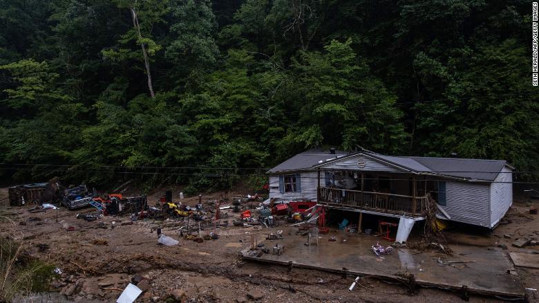 Debris surrounds a badly damaged home near Jackson, Kentucky, on July 31, 2022.