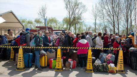 Ukrainian refugees are seen waiting to cross the border at the Palanca crossing between Ukraine and Moldova, on April 9, 2022.