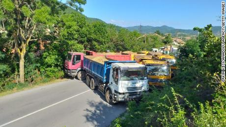 On August 1, trucks can be seen blocking the road at the Jarinje border crossing in Mitrovica, Kosovo.