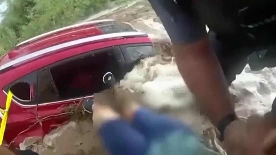 ‘The water is coming!’: First responders scramble to pull woman from flooding car – CNN Video