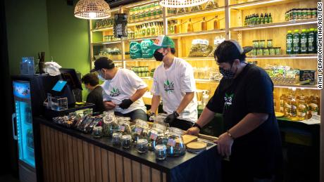 Staff members prepare cannabis at the RG420 cannabis store, at Khaosan Road, one of the favourite tourist spots in Bangkok, Thailand, July 31, 2022. REUTERS/Athit Perawongmetha