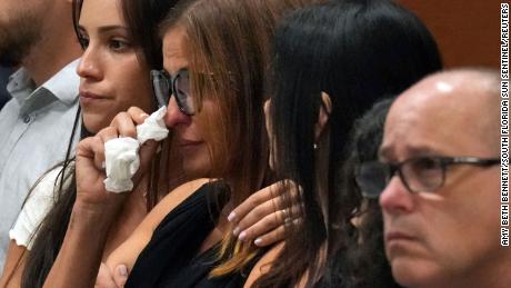 Patricia Oliver is comforted as a witness testifies to her son's fatal injuries during the penalty phase of the trial of high school shooter Marjory Stoneman Douglas at the Broward County Courthouse in Fort Lauderdale, Florida on Monday.