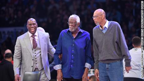 From left to right, Magic Johnson, Bill Russell and Kareem Abdul-Jabbar attend the NBA All-Star Game in February 2018 at Staples Center in Los Angeles. 