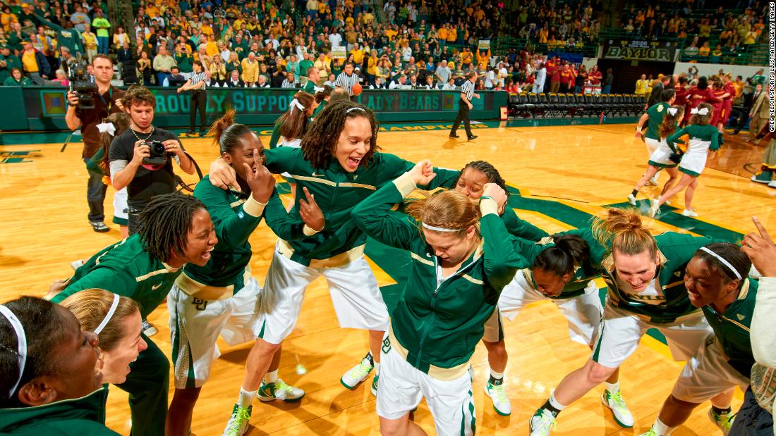Griner huddles with teammates before a game starts in 2012.