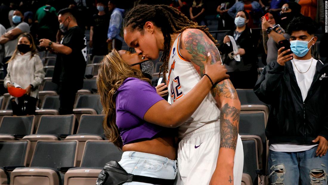 Griner kisses her wife Cherelle Griner after the Mercury defeated the Las Vegas Aces 87-84 in Game 5 of the 2021 WNBA Playoffs semifinals to win the series in October 2021.