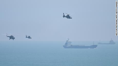 Chinese military helicopters fly past Pingtan Island, one of the closest points to mainland China from Taiwan on August 4, 2022.