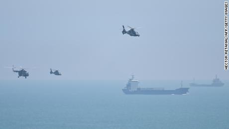 Chinese military helicopters fly past Pingtan island, one of mainland China's closest point from Taiwan on August 4, 2022.