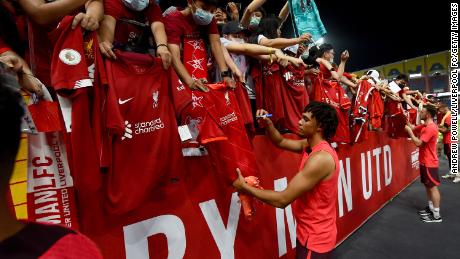 Alexander-Arnold signing autographs at the end of the open training session July 11 in Bangkok, Thailand. 