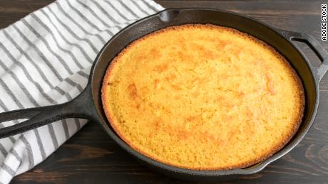 Savor the crispy, golden crust of cornbread after baking it in a cast-iron skillet.