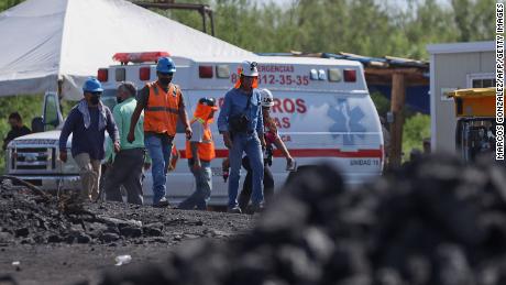 Rescue personnel work at the coal mine where 10 miners were trapped yesterday after a collapse, in the Agujita area, Sabinas municipality, Coahuila state, Mexico, on August 4, 2022. 