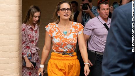 UNITED STATES - AUGUST 4: Sen. Kyrsten Sinema, D-Ariz., walks with staff as she leaves her hideaway office to go vote in the U.S. Capitol on Thursday, August 4, 2022. 