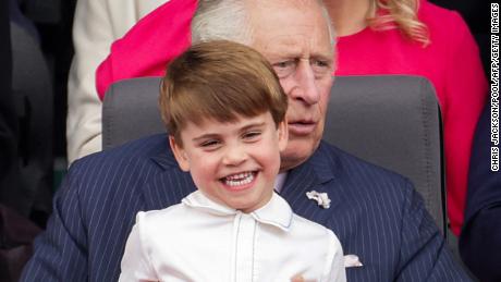 Prince Charles keeps Prince Louis entertained during the Platinum Contest in London on June 5.