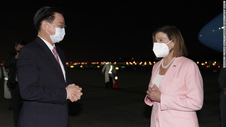 US House Speaker Nancy Pelosi is welcomed by Taiwanese Foreign Minister Joseph Wu after landing at Taipei Songshan Airport on August 2.