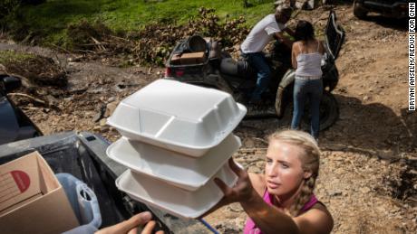 Kayla Slone delivers meals to flood victims in Pine Top, K.Y., on Thursday, August 4, 2022.CREDIT: Bryan Anselm/Redux for CNN