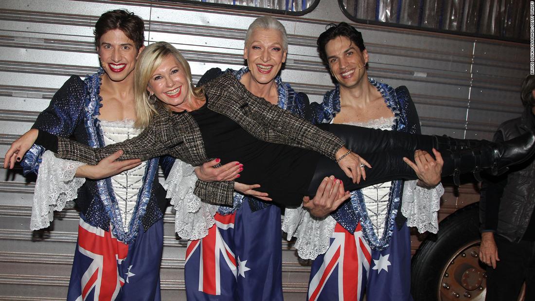 Newton-John is held by Nick Adams, Tony Sheldon and Will Swenson while attending the Broadway musical &quot;Priscilla, Queen of The Desert&quot; in 2011.