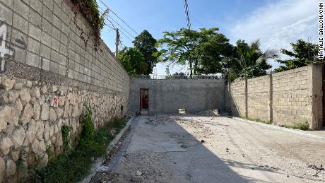 People in this neighborhood built a wall on a public road last month to keep out gangs who were kidnapping residents for ransoms. 