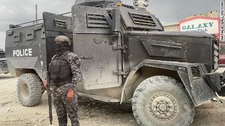 SWAT police stand guard following an anti-gang operation in Croix-des-Bouquets.