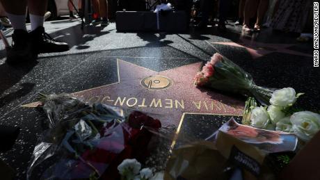 The star of late actor Olivia Newton-John is adorned with flowers and photographs on the Hollywood Walk of Fame in Los Angeles, California, U.S., August 8, 2022. REUTERS/Mario Anzuoni