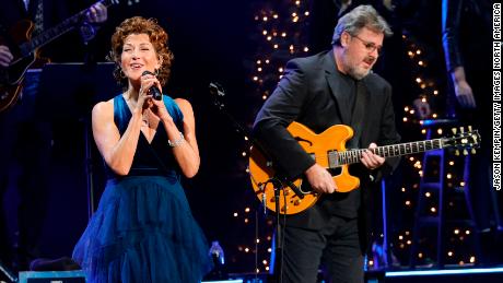 (From left) Amy Grant and Vince Gill perform at the Ryman Auditorium on December 13, 2021, in Nashville, Tennessee. 