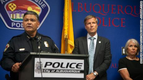Albuquerque Police Chief Harold Medina (left) was joined by Mayor Tim Keller and Gov. Michelle Lujan Grisham in announcing the suspect&#39;s arrest in a news conference on August 9,  2022.