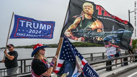 Supporters of former US President Donald Trump gather near his residence at Mar-A-Lago in Palm Beach, Florida, on August 9, 2022. - Former US President Donald Trump said on August 8, 2022, that his Mar-A-Lago residence in Florida was being &quot;raided&quot; by FBI agents in what he called an act of &quot;prosecutorial misconduct.&quot; (Photo by Giorgio VIERA / AFP) (Photo by GIORGIO VIERA/AFP via Getty Images)