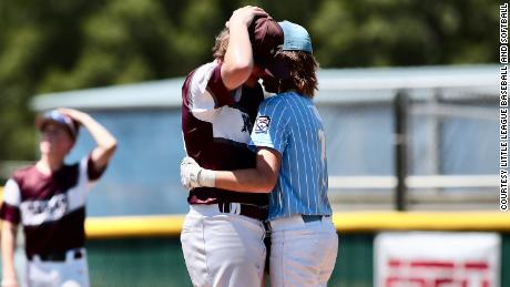 Oklahoma infielder Isaiah Jarvis, right, comforts East Texas pitcher Kaiden Shelton during the Southwest Little League Area Championship on Tuesday after being hit by Kaiden's pitch.