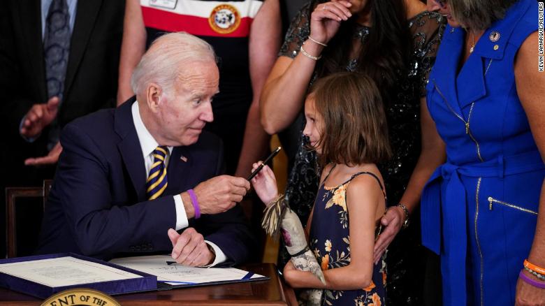 Biden signs bill to help millions of veterans exposed to burn pits