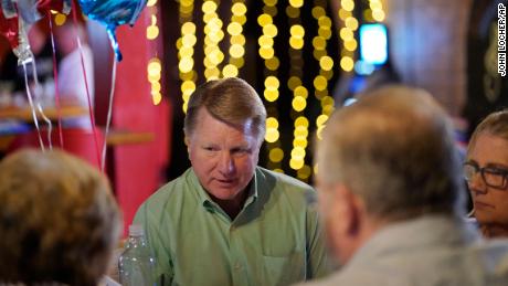 Jim Marchant, center, the GOP nominee for secretary of state in Nevada, speaks with people at a political event July 16, 2022, in Pahrump, Nev. 