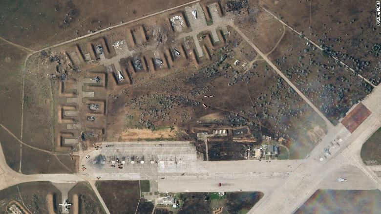 A satellite image from August 10, after the explosion, shows the charred remains of at least seven aircraft in the earthen berms.  