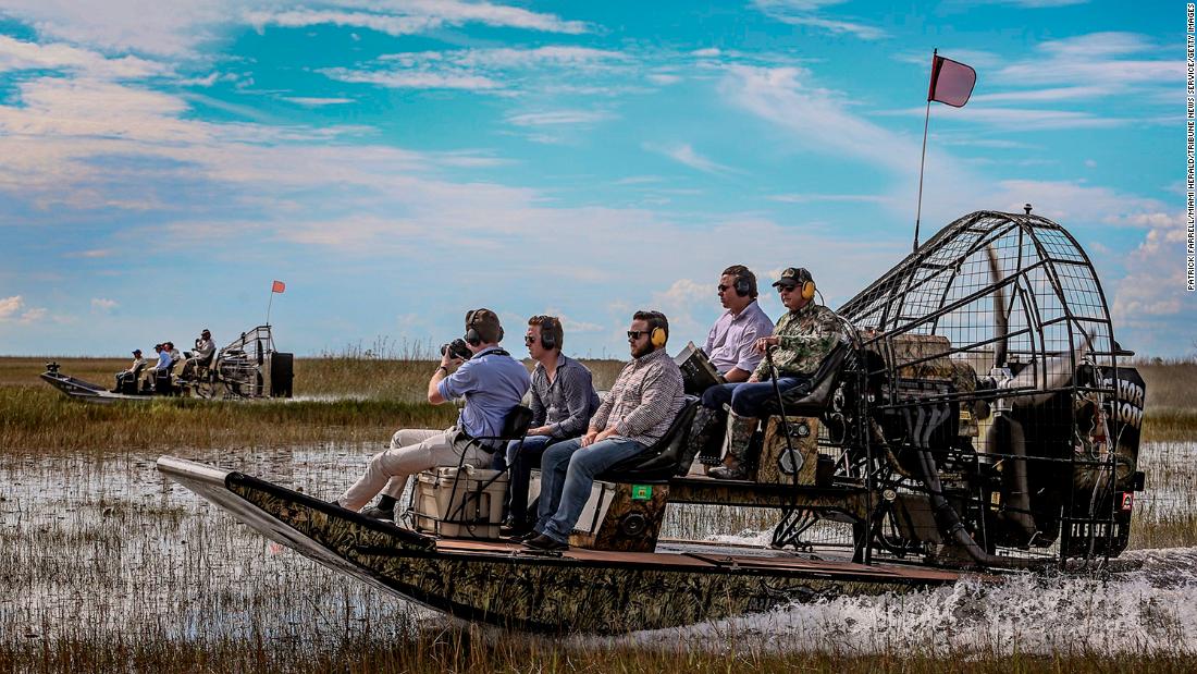 DeSantis, second from right, takes an airboat tour of the Florida Everglades in September 2018. He was running for governor at the time.
