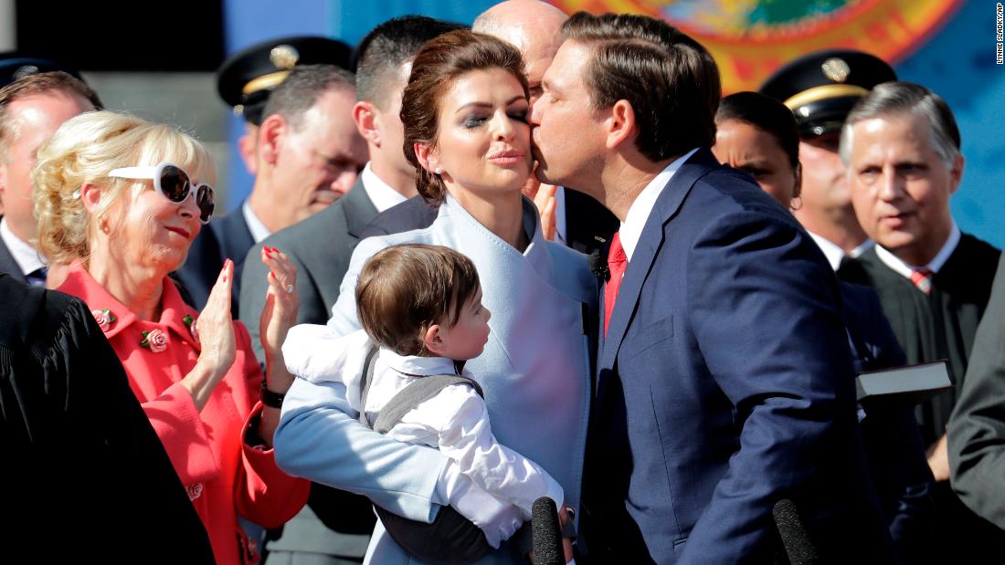 DeSantis kisses his wife after being sworn in as governor in January 2019.