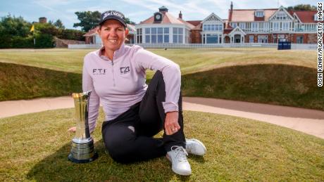 GULLANE, SCOTLAND - AUGUST 08:  Ashleigh Buhai of South Africa pictured with the AIG Women&#39;s Open trophy on the 18th green after the the AIG Women&#39;s Open at Muirfield on August 08, 2022 in Gullane, Scotland. (Photo by Oisin Keniry/R&amp;A/R&amp;A via Getty Images)