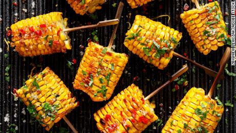 Butter, herbs, salt and aromatic spices help to liven up this luscious grilled corn on the cob.