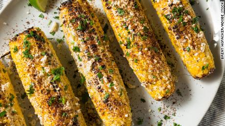 The Mexican corn dish elote features corn on the cob with mayonnaise, lime juice and cheese.