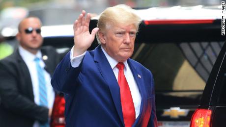 Former US President Donald Trump waves while walking to a vehicle outside of Trump Tower in New York City on August 10, 2022. - Donald Trump on Wednesday declined to answer questions under oath in New York over alleged fraud at his family business, as legal pressures pile up for the former president whose house was raided by the FBI just two days ago. (Photo by STRINGER / AFP) (Photo by STRINGER/AFP via Getty Images)