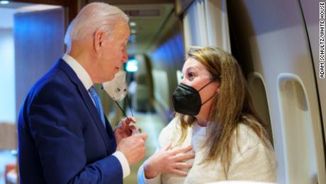 President Joe Biden speaks with Director of Message Planning Meghan Hays aboard Air Force One at Royal Air Force Base Mildenhall in Suffolk, England Saturday, March 26, 2022. (Official White House Photo by Adam Schultz)