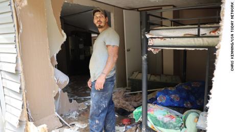 Dustin Elam, 31, stands in his children&#39;s former bedroom after his home was destroyed by flooding in Breathitt County, Kentucky.