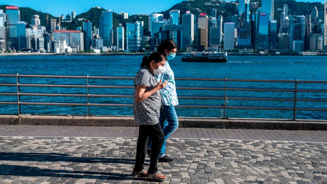 People wearing face masks walking in Hong Kong on July 12.