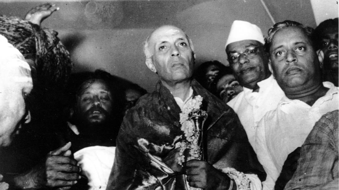 The first Prime Minister of India, Jawaharlal Nehru, holds a mace of gold on the eve of India&#39;s independence in New Delhi, India, on August 14, 1947.