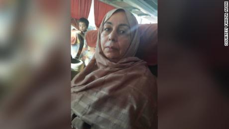 Judge Fawzia Amini is pictured on an overnight bus ride to Mazar-e-Sharif, from where she flew out of the country.