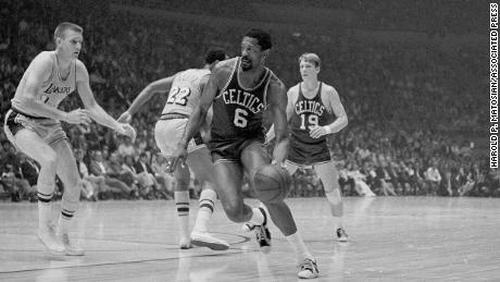 Russell driving to the basket against the Lakers in the team's final NBA playoff game in 1969, which the Celtics won and retained their title. 