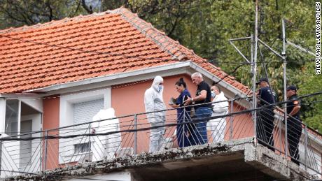State Prosecutor Andrijana Nastic speaks to the forensic team at the house where a gunman started a mass shooting in Cetinje, Montenegro August 12, 2022.
