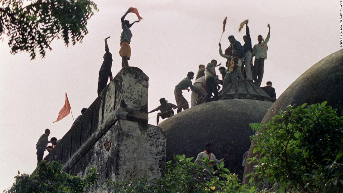 Hindu activists climb on top of the Babri Masjid, five hours before the mosque was demolished by Hindu fundamentalists in 1992. More than 2,000 people -- mostly Muslims -- were killed in nationwide rioting following the demolition, some of the worst violence seen in India since independence.
