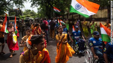 Women in traditional attire participate in a rally to mark the 75th anniversay of India&#39;s Independence Day in Mumbai, India, on August 14, 2022.