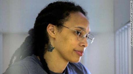 US Women&#39;s National Basketball Association (WNBA) basketball player Brittney Griner, who was detained at Moscow&#39;s Sheremetyevo airport and later charged with illegal possession of cannabis, waits for the verdict inside a defendants&#39; cage during a hearing in Khimki outside Moscow, on August 4, 2022. - A Russian court found Griner guilty of smuggling and storing narcotics after prosecutors requested a sentence of nine and a half years in jail for the athlete. (Photo by EVGENIA NOVOZHENINA / POOL / AFP) (Photo by EVGENIA NOVOZHENINA/POOL/AFP via Getty Images)