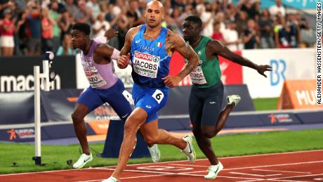 Jacobs crosses the finish line during the men&#39;s 100m final at the 2022 European Championships.