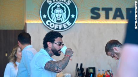 Russian singer and entrepreneur Timur Yunusov, better known as Timati, drinks coffee at a newly opened Stars Coffee coffee shop in the former location of the Starbucks coffee shop in Moscow, Russia, 